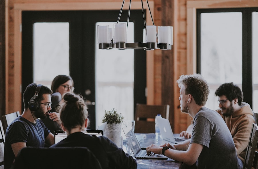 A small team reviewing work together in a meeting